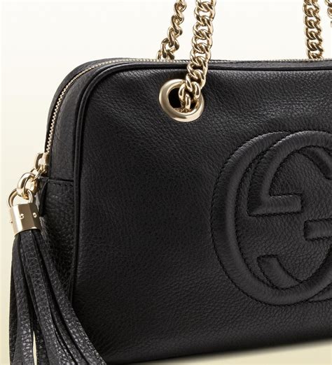 black gucci handbag with white|Gucci black leather shoulder bag.